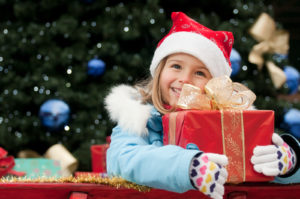 1481049826_bigstock-little-girl-in-christmas-sledg-16367444